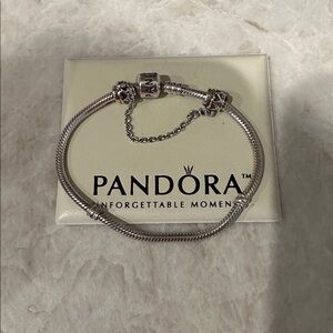 Pandora elegant silver bracelet w/ safety chain clip attached.